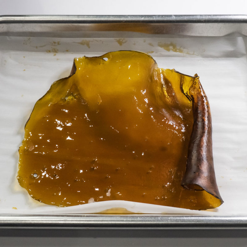 Finished Brown CBD Shatter on a Glass Tray